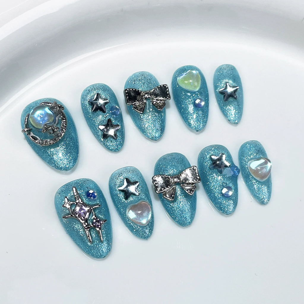 Sparkling Aqua Blue Press-On Nails with Stars, Moon & Pearls | Dreamy Ocean & Starry Sky Nail Art for Summer & Parties