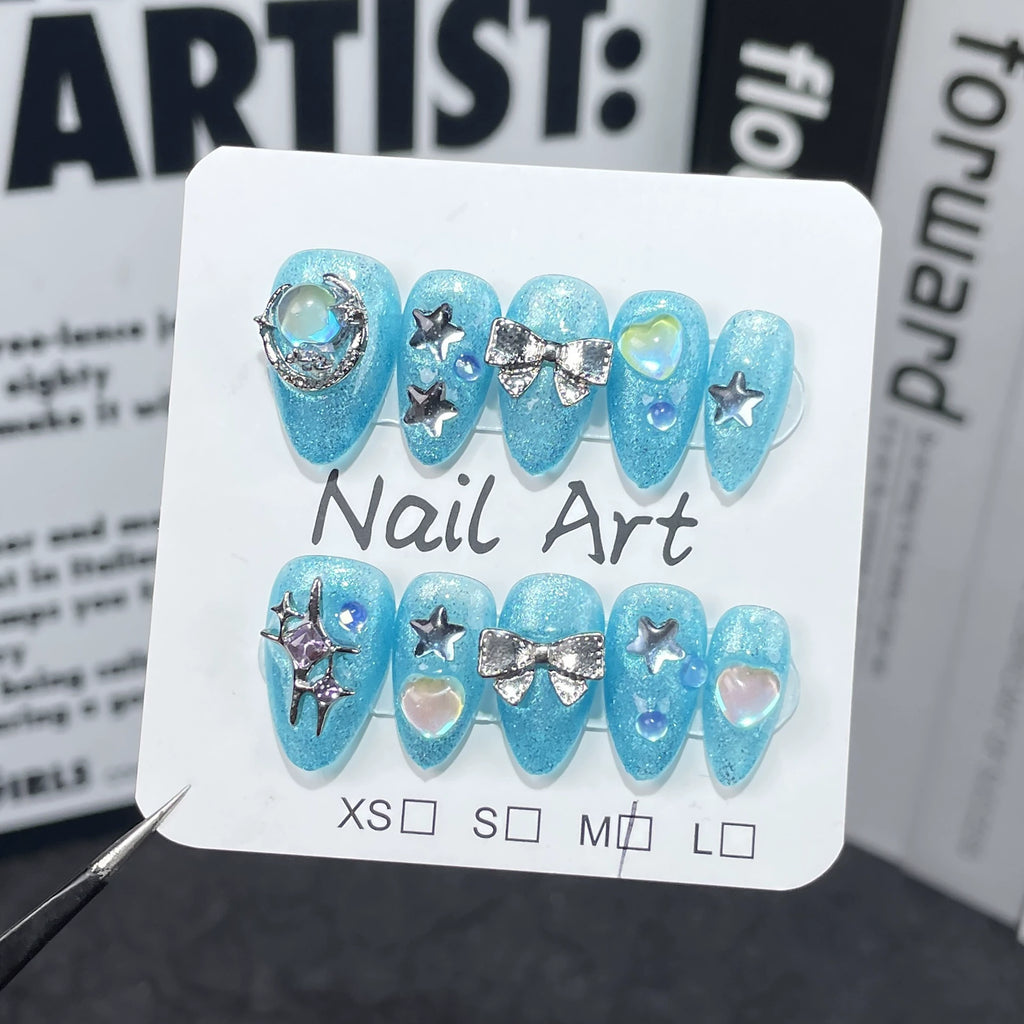Sparkling Aqua Blue Press-On Nails with Stars, Moon & Pearls | Dreamy Ocean & Starry Sky Nail Art for Summer & Parties
